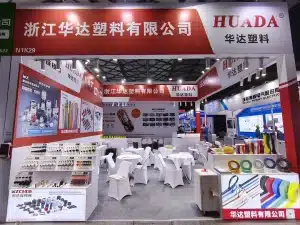 Huada Plastic exhibition booth at EP Shanghai, showcasing nylon cable ties, heat shrink tubing, cable accessories, and wiring management products.