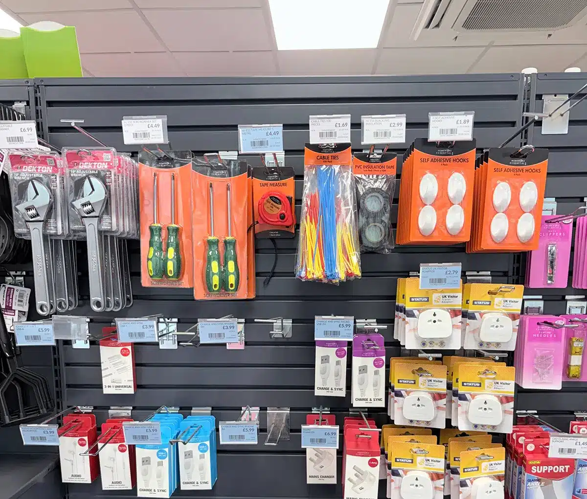 Assorted cable ties displayed with everyday tools in a UK retail store